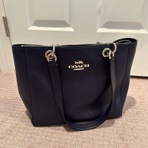 Coach Jes Tote Navy leather. Large tote. With interior cell phn and zipper pkt.